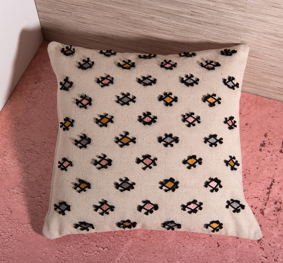 Cream decorative pillow with patterns by Déniché Boutique